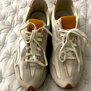 Gently used Women’s New Balance 327 sneakers.  Size 8.  Off white/orange.